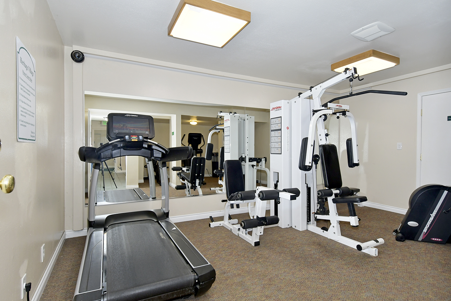 Heritage Village, an all age manufactured home community has fitness center with treadmill and weight machine.