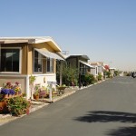 Manufactured home community with peaceful neighborhood and landscaped yards. Wide, clean, paved streets.