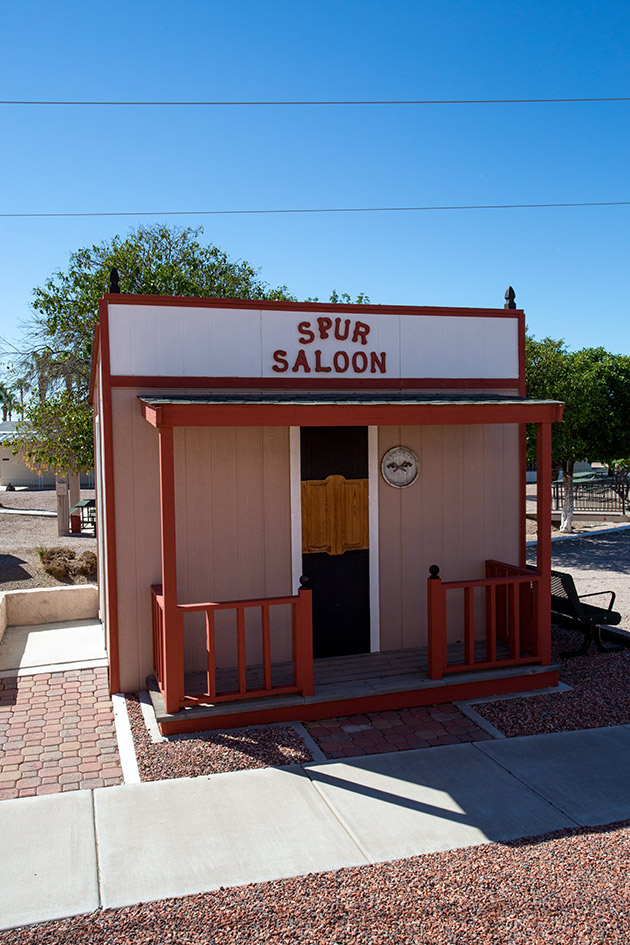 A Spur Saloon made of wood looks like the real thing and is on display.