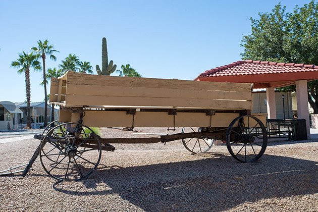 Silver Spur Village has decor throughout the community of the old west. An old wagon with wooden wheels is placed on display.