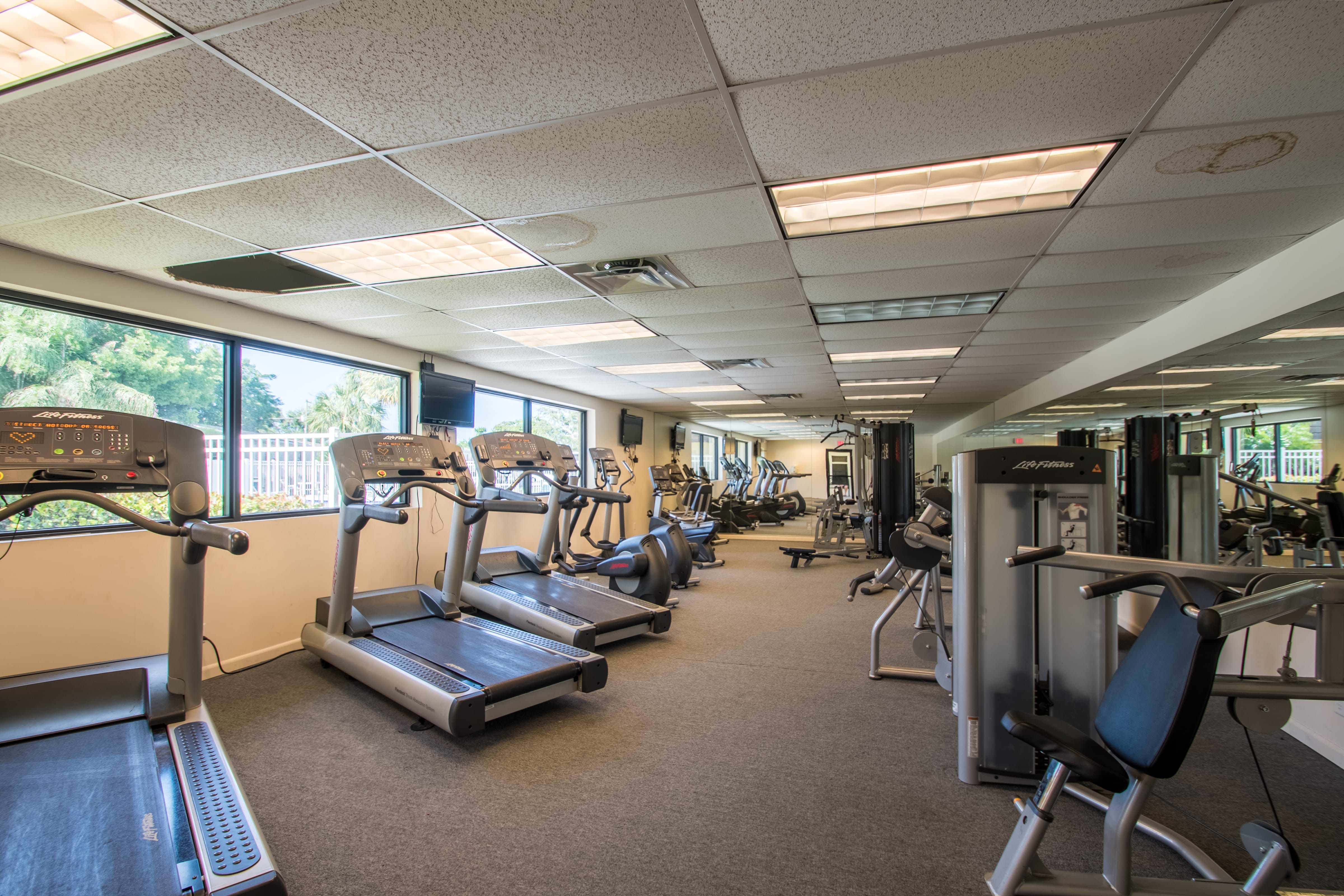 Fitness center has treadmills, stationary bikes and weight machines.