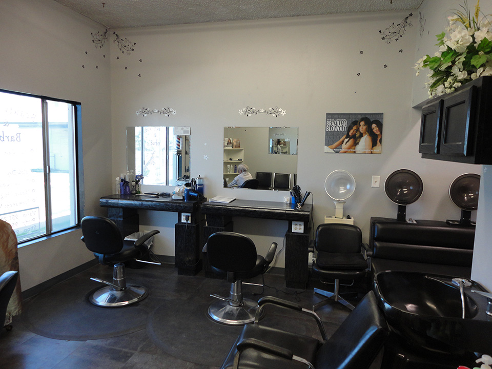 The on-site hair salon equipped with salon chairs for washing, cutting, styling, and blow-drying hair.