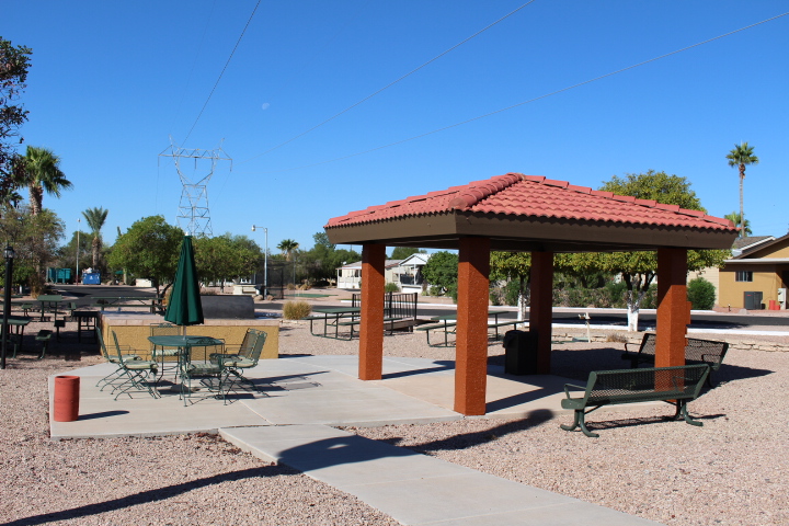 Outdoor BBQ area with picnic tables and benches