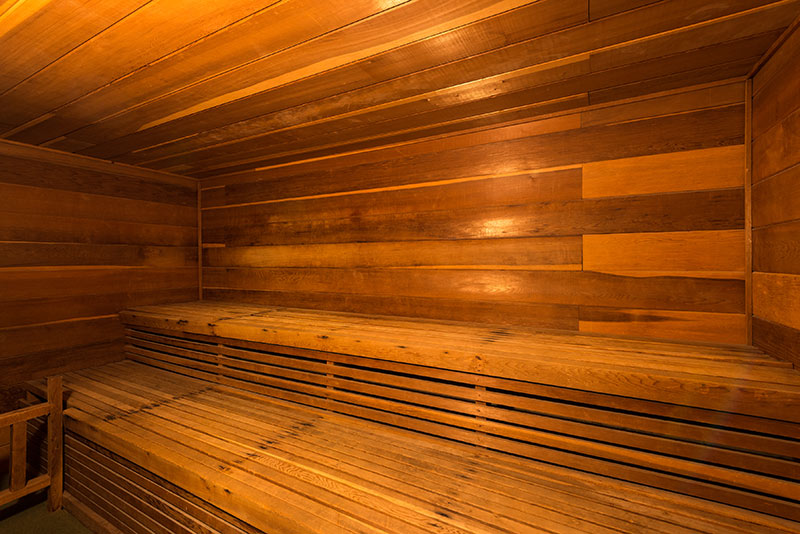 Large indoor sauna, fully enclosed by wood.